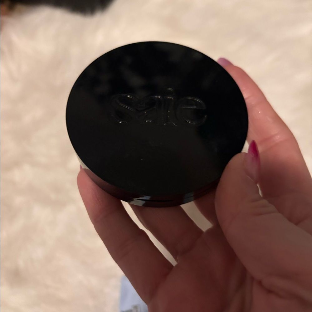 Saie Black Compact with Peach Glow